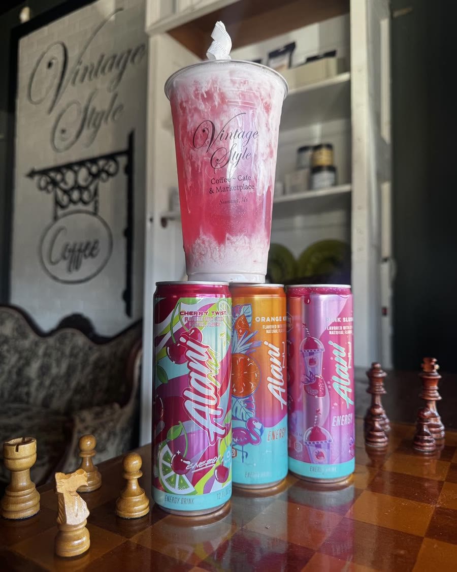 Frozen Alani energy refresher with cans on a chess board