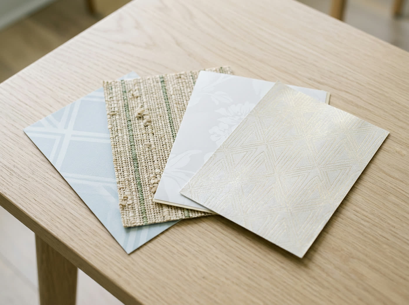 Custom wallpaper material samples in a range of finishes and textures