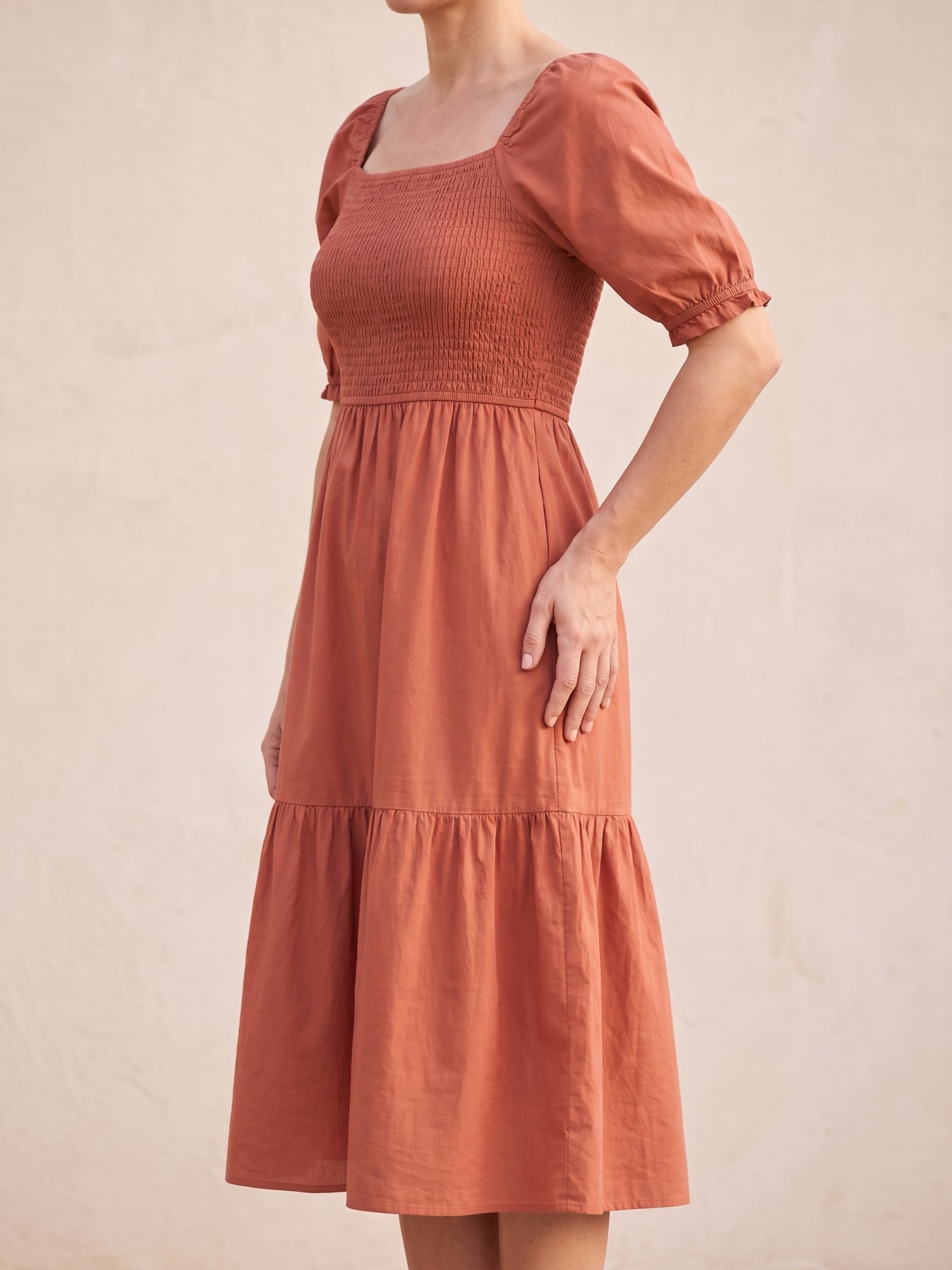 Women's Puff Sleeve Smocked Midi Dress in Terracotta, side view