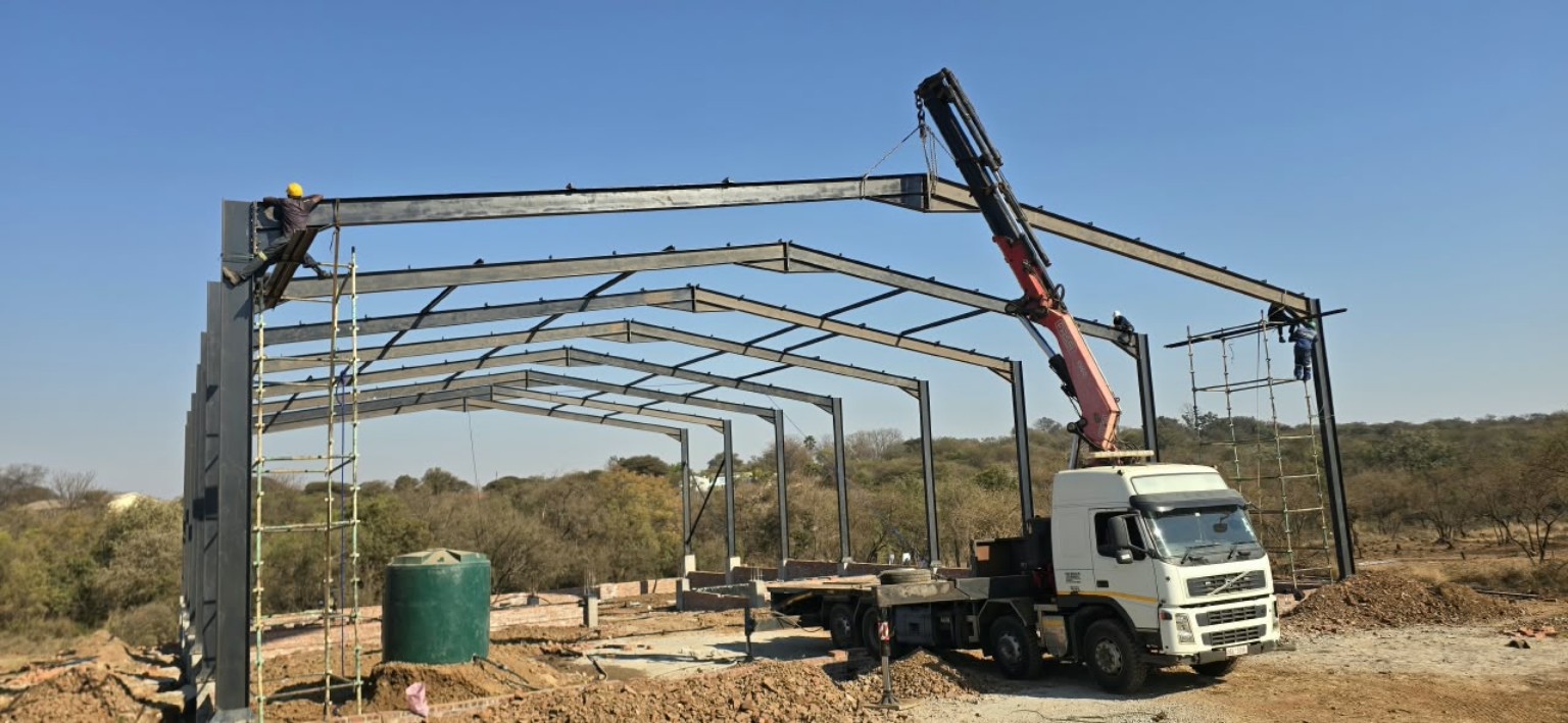 Structural steel being erected with a PONK crane