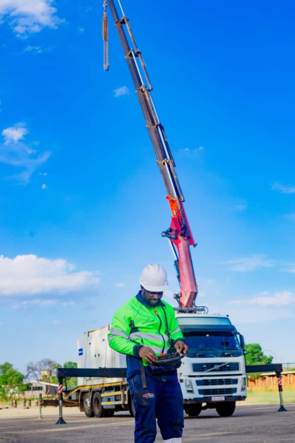 PONK crane operator working beside the crane truck