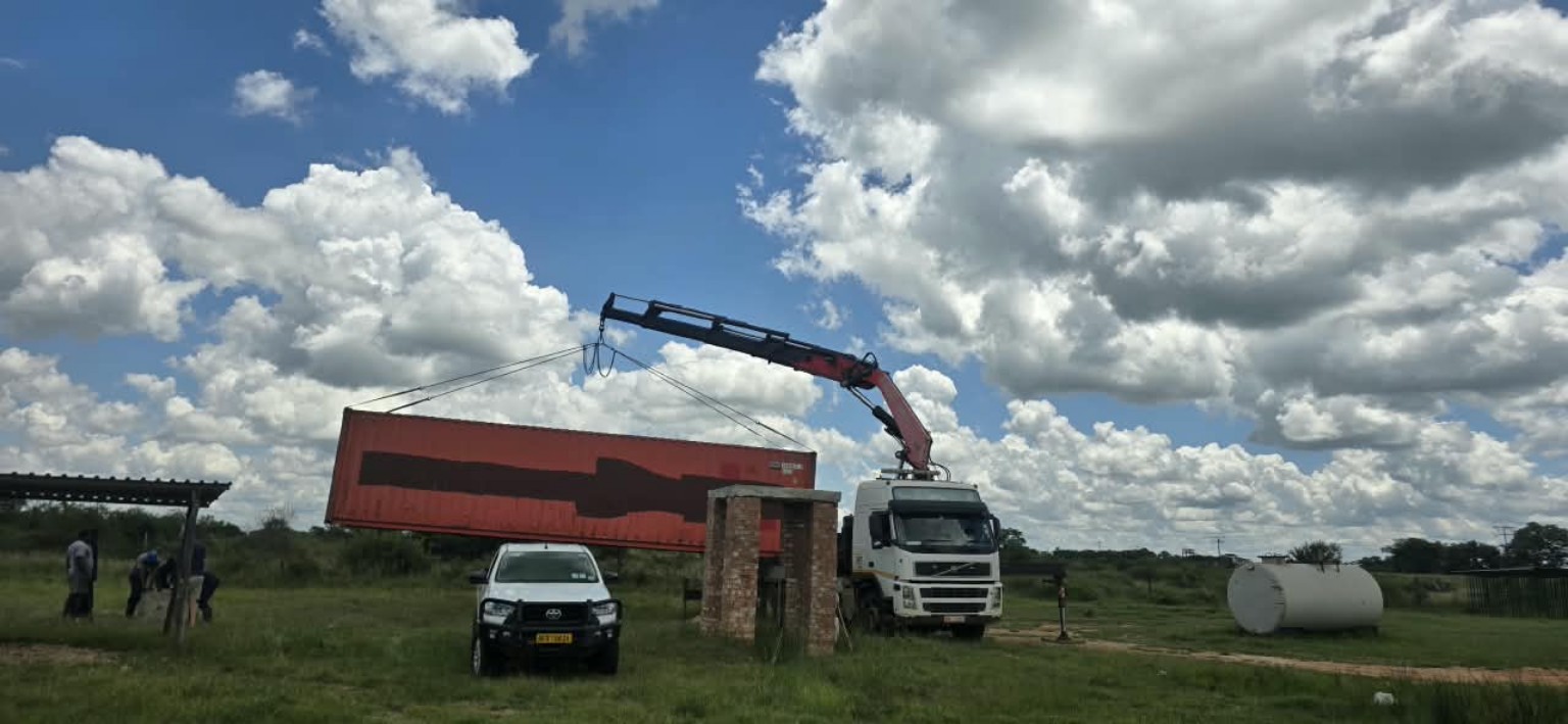 Container being lifted by a PONK crane